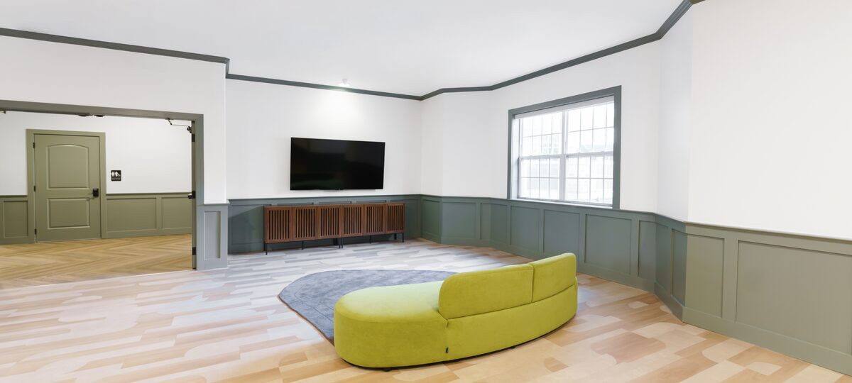 Open lounge with a large-screen media area