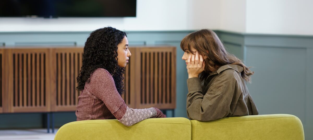 Peer support conversation in a quiet lounge